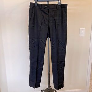 Brand new with tags Mens Perry Ellis black plaid dress pants. Size 33x32.
